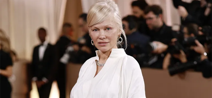 Pamela Anderson Teams a White Button-Down with Piles of Diamonds and an Icy Blonde Updo at 2026 Golden Globes 1