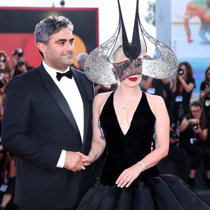 Lady Gaga Shuts Down the Venice Film Festival Red Carpet With a Black Ball Gown and Mesmerizing Headpiece