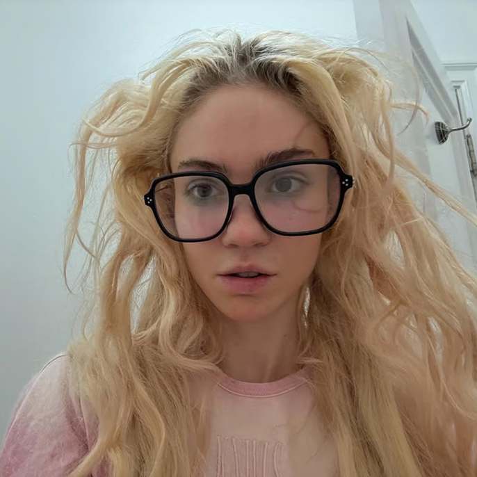 Grimes Unveils Large Face Tattoo