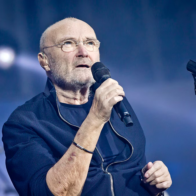Phil Collins Uses Crutches During Rare Public Appearance After Revealing Five Knee Surgeries