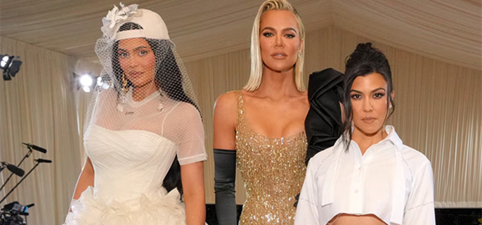 Khloe Kardashian, Kourtney Kardashian Call Out Kylie Jenner for Cropping Them Out of Family Photo 1
