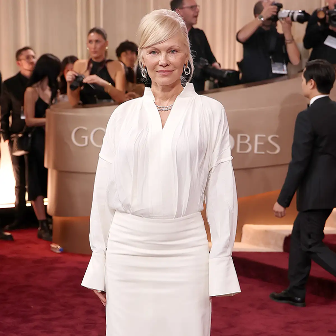 Pamela Anderson Teams a White Button-Down with Piles of Diamonds and an Icy Blonde Updo at 2026 Golden Globes