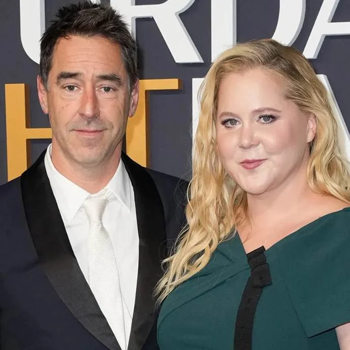 Amy Schumer addresses speculation about marriage: 'Chris and I are still married'