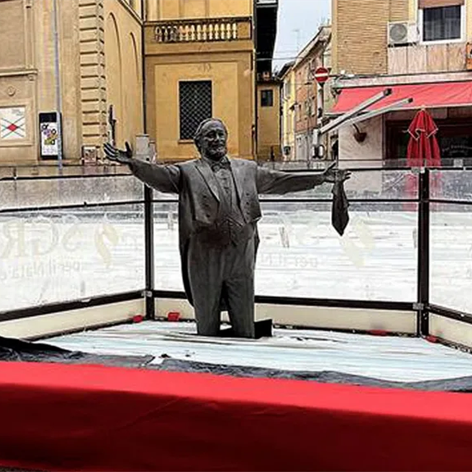 Pavarotti statue frozen knee-deep in ice rink strikes wrong note in Italy