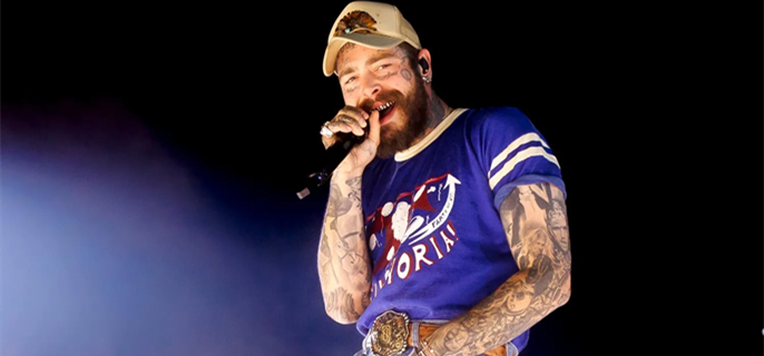 Post Malone falls off concert stage while reaching out to toast a fan 1